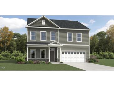 Charming two-story home with neutral siding, white trim, and attached two-car garage at 1303 Cosmic Dr, Durham, NC 27703