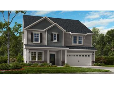Charming two-story home with a welcoming covered porch and an attached two-car garage at 209 Seagraves Creek Ln, Holly Springs, NC 27540