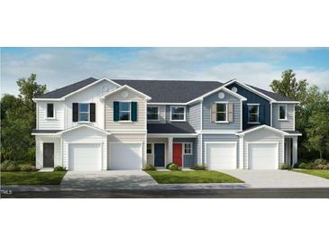 Charming townhome with modern exteriors, garage, and manicured lawns at 10609 Brookside Reserve Rd, Raleigh, NC 27614