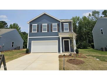 Charming two-story home with a two-car garage and classic curb appeal at 134 N Keatts Winner Ct, Wilson's Mills, NC 27520