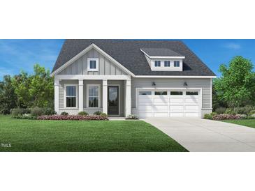 Charming home featuring a 2-car garage, beautiful landscaping, and welcoming front porch at 2400 Abbeyhill Dr # 36, Raleigh, NC 27610