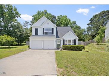 Charming two-story home featuring a two-car garage, well-manicured lawn, and inviting curb appeal at 4805 Castle Crest Ct, Raleigh, NC 27616
