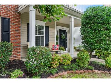 Charming front porch with comfortable seating and lovely landscaping at 732 Keystone Park Dr, Morrisville, NC 27560