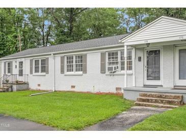 Charming brick duplex with well-maintained lawn and inviting entrance at 1400 Roslyn Dr # 17B, Burlington, NC 27215