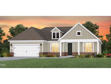 Charming single-Gathering home boasting a two-car garage, well-manicured lawn, and welcoming front porch at 2512 Del Webb Gardens Dr, Fuquay Varina, NC 27526