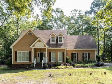 Charming single-Gathering home featuring dormer windows and a landscaped front yard at 301 Monterey Ct, Benson, NC 27504
