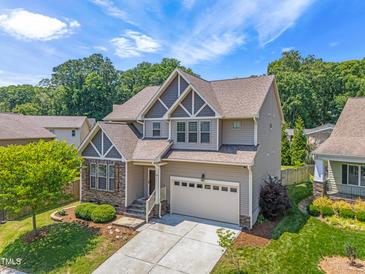 Beautiful two-story home with manicured lawn, landscaping, and a two-car garage in a Gathering-friendly neighborhood at 118 Fox Run Ct, Durham, NC 27705