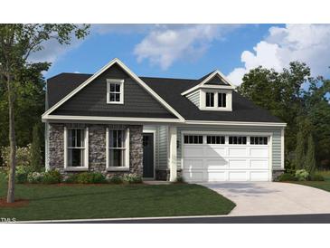Charming home featuring stone accents, gray shingles, light blue siding, a 2-car garage and well-manicured lawn at 2004 Kapalua Way # 189, Durham, NC 27703