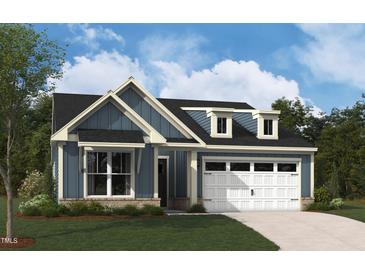 Charming two-story home with a manicured lawn and attached two-car garage at 2012 Kapalua Way # 193, Durham, NC 27703