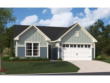Charming two-story home with a two-car garage, well-manicured lawn, and traditional architectural details at 2013 Kapalua Way # 197, Durham, NC 27703