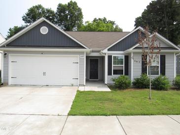Charming single-story home with a two-car garage and well-maintained front lawn at 2039 Alderman Way, Creedmoor, NC 27522