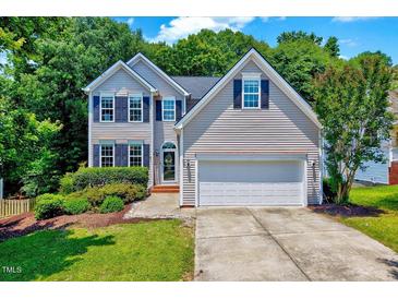 Charming two-story home with manicured lawn, attached two-car garage, and well-maintained landscaping at 2501 Springfield Park Dr, Raleigh, NC 27614