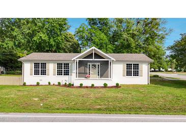 Charming one-story home with a landscaped front yard and lovely curb appeal at 309 S Mckay Ave, Dunn, NC 28334