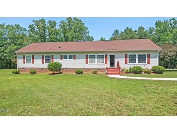 Charming ranch-style home with red shutters, a well-manicured lawn, and mature trees, perfect for a serene living at 4403 Jeffries Rd, Durham, NC 27704