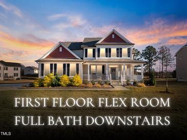 Charming two-story home featuring classic architectural details and a beautifully landscaped front yard, creating a welcoming curb appeal at 46 Two Belles Ct, Angier, NC 27501