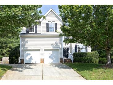 Charming two-story home featuring a two-car garage and manicured landscaping at 803 High Ct, Hillsborough, NC 27278