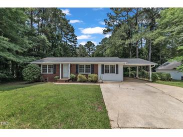 Charming single-story home with brick and white siding, and an inviting carport at 804 Colonial Dr, Raleigh, NC 27603