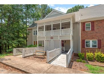 Charming condo boasts dual balconies, a ramp, and an inviting outdoor bench at 106 Choptank Ct # B-2, Cary, NC 27513
