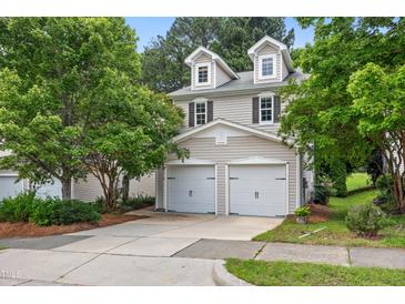 Charming two-story home featuring a two-car garage and well-maintained landscaping at 2018 Remington Oaks Cir, Cary, NC 27519