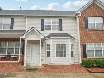 Charming townhouse featuring a covered entryway, bay window, and a mix of siding and brick facade at 2845 Bennington Dr, Clayton, NC 27520
