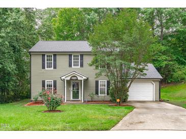 Charming two-story home with a well-manicured lawn and a classic facade at 3330 Nantuckett Ave, Durham, NC 27703
