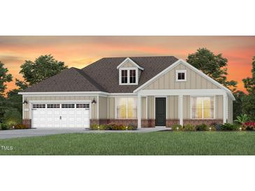 Charming single-story home with a neutral color palette, attached garage, and well-manicured lawn at 87 Arcadius Dr, Clayton, NC 27520