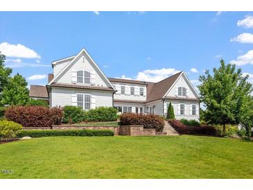 Stunning home featuring a meticulously landscaped front yard and classic architectural details and multi-level garden at 1342 Briar Chapel Pkwy, Chapel Hill, NC 27516