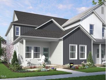Charming two-story home with a covered front porch and beautifully landscaped front yard at 2922 Alyssa Ct, Raleigh, NC 27604