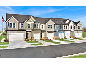 Charming townhome exteriors featuring multiple units and a community atmosphere in a residential neighborhood at 1227 Bessie Ct, Wake Forest, NC 27587