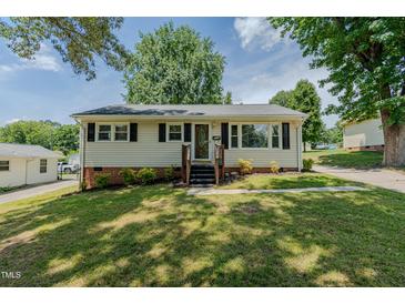 Charming single-story home with a well-manicured lawn, wood stairs, and a traditional design at 2112 Mckinney St, Burlington, NC 27217