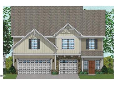 Charming two-story home with a symmetrical facade, stone accents, and attached two-car garage at 60 Black Walnut Dr # 198, Garner, NC 27529