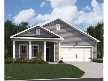 Charming single-Gathering home with a two-car garage, inviting front porch, and well-maintained lawn at 124 W Crescent Mills S Blvd # Homesite 250, Wilson's Mills, NC 27520