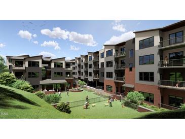 Modern apartments with balconies overlook a dog park and courtyard, creating a vibrant community space at 130 Two Hills Dr # 104B, Carrboro, NC 27510