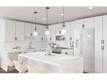 Modern kitchen featuring white cabinetry, marble countertops and stainless steel appliances at 130 Two Hills Dr # 201B, Carrboro, NC 27510