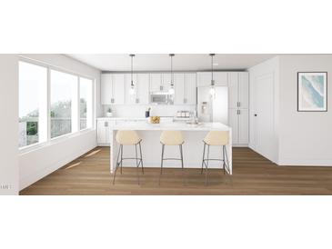 Modern kitchen with white cabinets, marble countertops, and stainless steel appliances at 130 Two Hills Dr # 205B, Carrboro, NC 27510