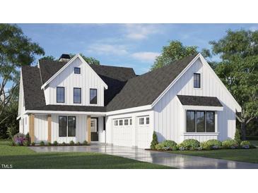 Stunning two-story modern farmhouse featuring white siding, black trim, a three-car garage and a well-manicured lawn at 1053 Azalea Garden Cir, Raleigh, NC 27603