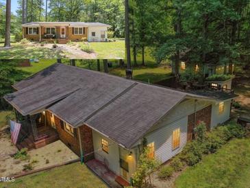 Aerial view of house with lush green trees at 1139 Princeton Kenly Rd, Kenly, NC 27542