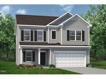 Charming two-story home with gray siding, black shutters, a two-car garage, and a well-manicured lawn at 126 Mildred Place, Broadway, NC 27505