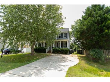Charming two-story home with inviting front porch and well-maintained landscaping at 328 Mccarthy Dr, Clayton, NC 27527