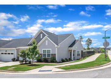 Charming single-Gathering home with well-manicured lawn, stone accents, and inviting curb appeal on a corner lot at 1021 Shellbank Dr, Durham, NC 27703