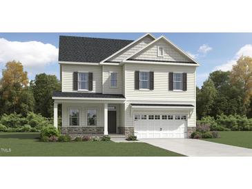 Charming two-story home with white siding, black shutters, and stone accents on the facade and garage at 1240 Hazelnut Ridge Ln, Knightdale, NC 27545