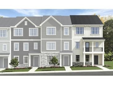 Charming townhome exteriors showcasing a variety of attractive facades, landscaping, and inviting entryways at 1416 Jay Rd, Knightdale, NC 27545