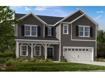 New construction gray two-story home with a two-car garage and covered porch at 113 Seagraves Creek Ln, Holly Springs, NC 27540