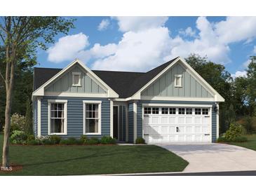 Charming single-Gathering home featuring light blue siding, a two-car garage, and lush green lawn at 2019 Kapalua Way # 200, Durham, NC 27703