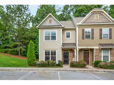 Charming townhouse with a well-maintained lawn and inviting curb appeal on a sunny day at 6301 Pesta Ct, Raleigh, NC 27612