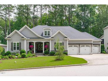 Charming single-Gathering home features a landscaped front yard and three-car garage at 2121 Vecchio Ln, Apex, NC 27502
