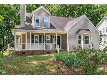 Charming two-story home with a welcoming front porch and well-maintained landscaping at 2324 Dahlgreen Rd, Raleigh, NC 27615