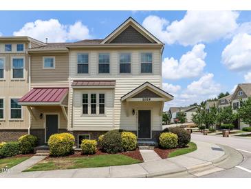 Charming two-story townhome with well-manicured landscaping and inviting entrance at 1019 Tranquil Crk Way, Wake Forest, NC 27587