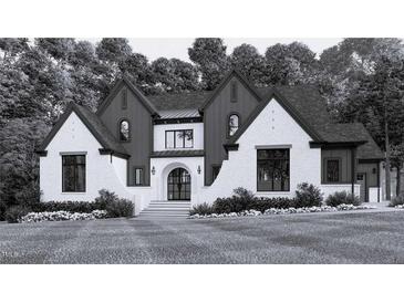 Stunning new construction featuring a stylish mix of painted brick and vertical board and batten at 115 Evington Dr # 29, Pittsboro, NC 27312