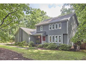 Charming two-story home featuring a well-manicured lawn and lush landscaping adding to its curb appeal at 2334 Dawn Trl, Durham, NC 27712